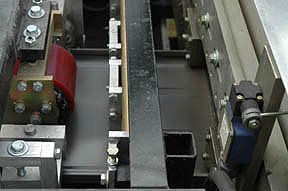 As it goes thru the machine